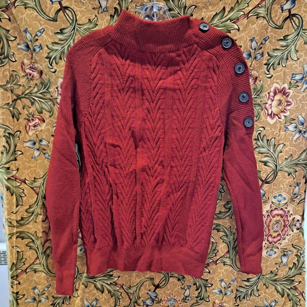 Long sleeve red sweater with button opening on the right shoulder